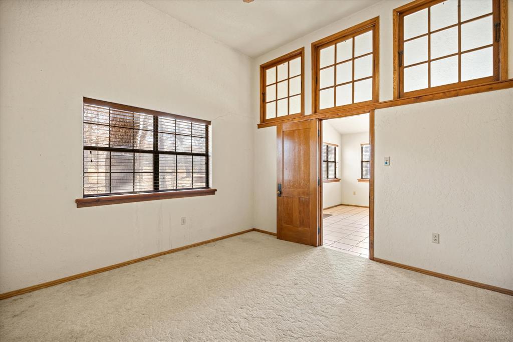 1601 Stafford Road Weatherford, TX 76088 - Photo 9 of 40 an empty room with windows