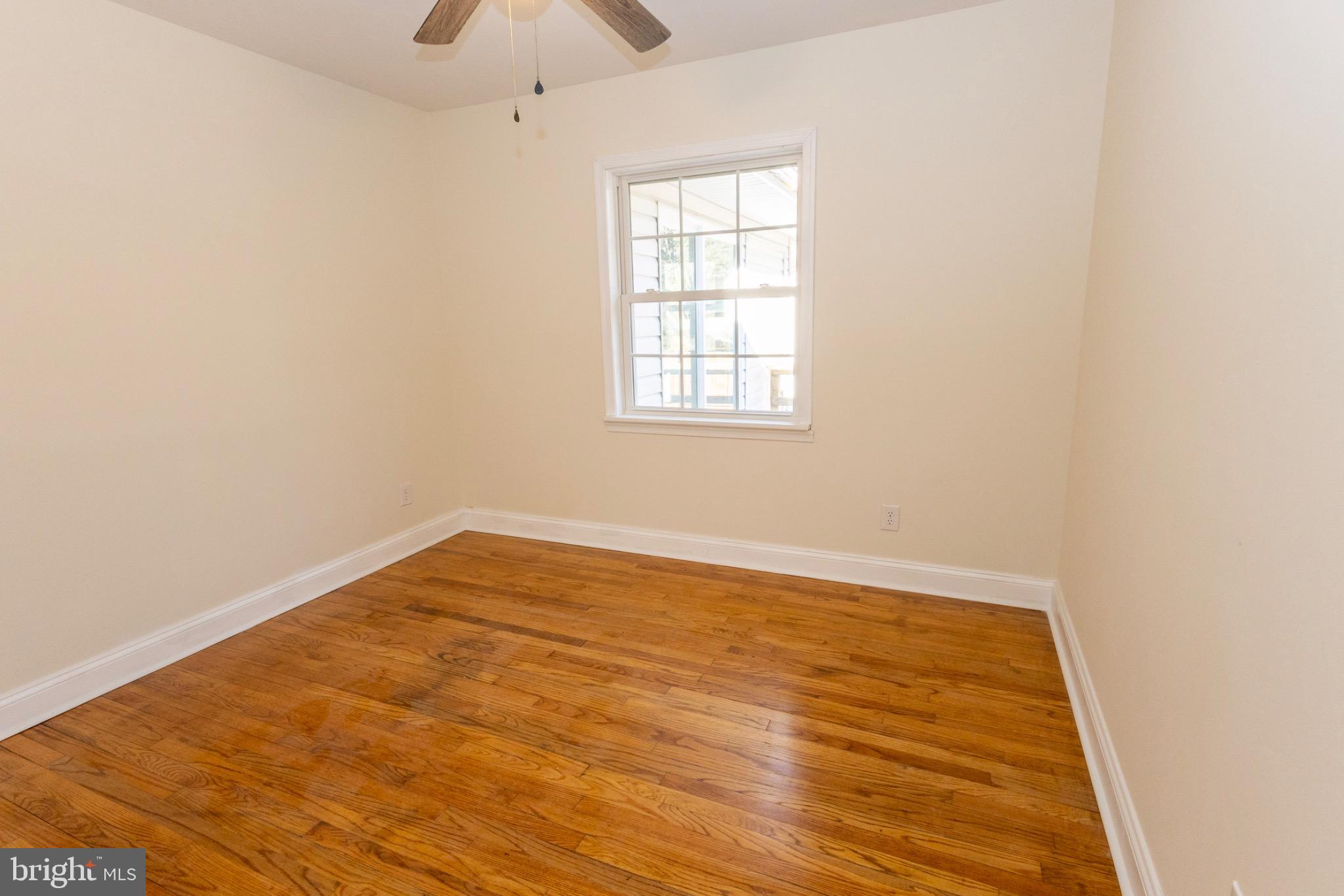 49151 Wynne Road Ridge, MD 20680 - Photo 35 of 80 Bright and airy bedroom with hardwood floors.