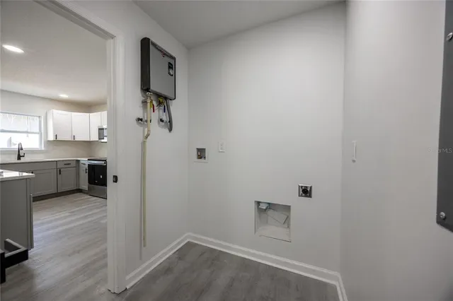 a view of a kitchen with a sink and cabinets