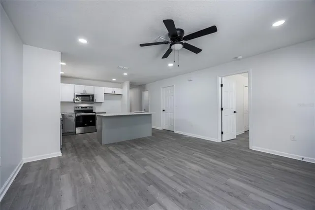 a view of kitchen with cabinets and wooden floor