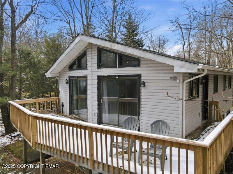 2167 Freedom Way Pocono Summit, PA 18346 - Photo 11 of 45 a view of a house with a small yard and wooden fence
