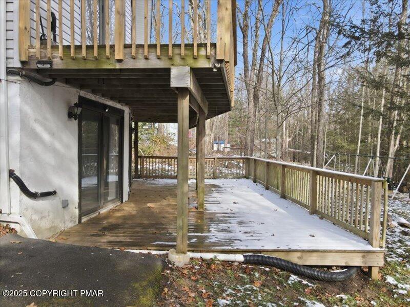 2167 Freedom Way Pocono Summit, PA 18346 - Photo 13 of 45 a view of a balcony with wooden floor and fence
