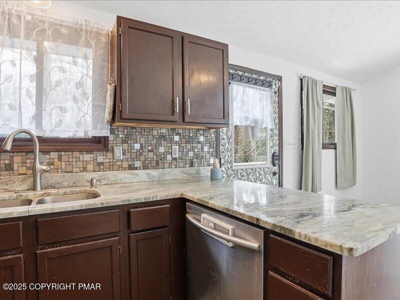 2167 Freedom Way Pocono Summit, PA 18346 - Photo 22 of 45 a kitchen with a sink and a window