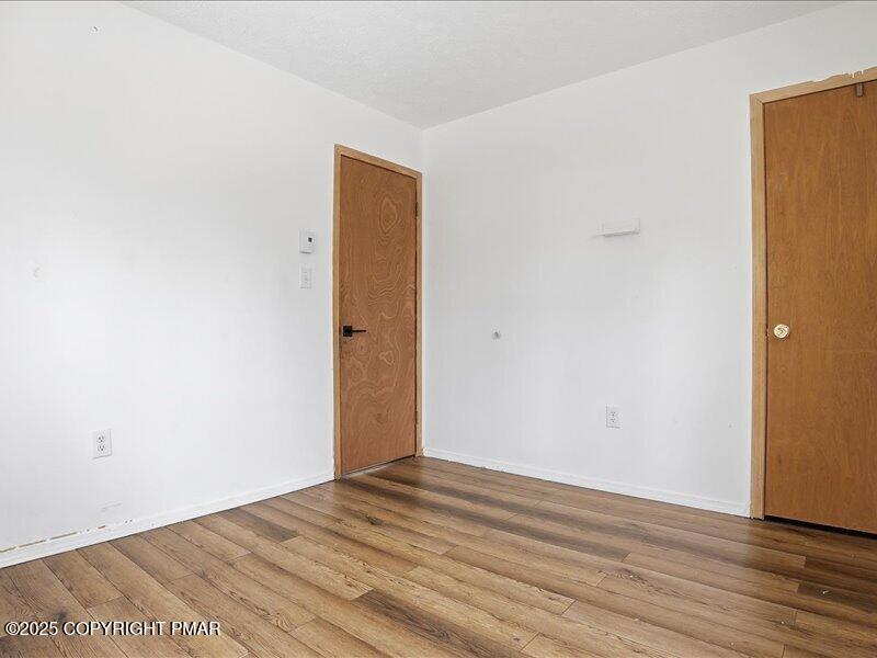 2167 Freedom Way Pocono Summit, PA 18346 - Photo 24 of 45 a view of empty room with wooden floor
