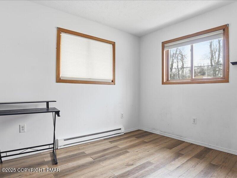 2167 Freedom Way Pocono Summit, PA 18346 - Photo 25 of 45 a view of an empty room with wooden floor and window