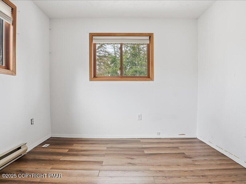 2167 Freedom Way Pocono Summit, PA 18346 - Photo 27 of 45 a view of empty room with wooden floor and fan