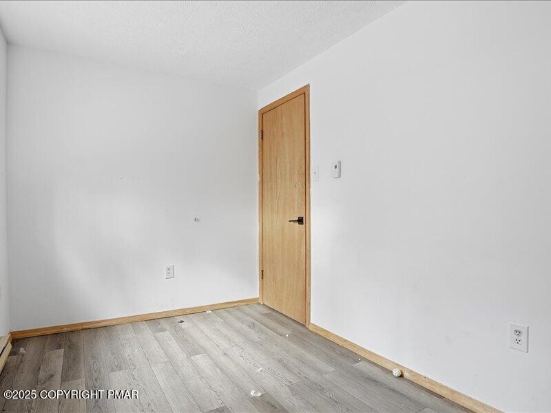 2167 Freedom Way Pocono Summit, PA 18346 - Photo 31 of 45 a view of an empty room with wooden floor and closet