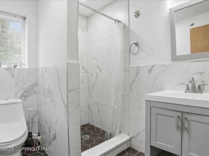 2167 Freedom Way Pocono Summit, PA 18346 - Photo 32 of 45 a bathroom with a sink toilet and shower