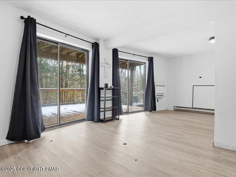 2167 Freedom Way Pocono Summit, PA 18346 - Photo 33 of 45 a view of an empty room with glass door
