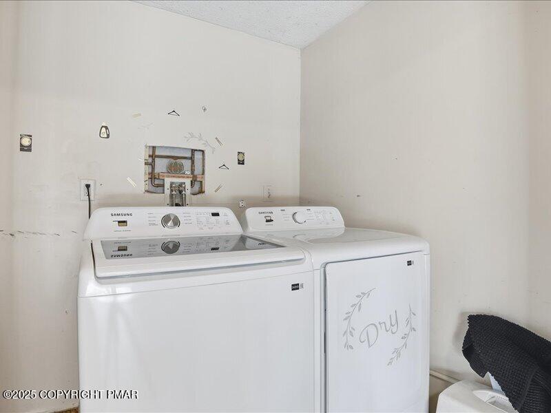 2167 Freedom Way Pocono Summit, PA 18346 - Photo 41 of 45 a utility room with dryer and washer