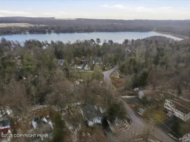 a view of a house with a yard and garage