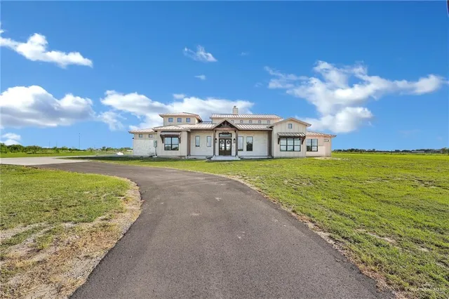 a view of an ocean with a building in the background