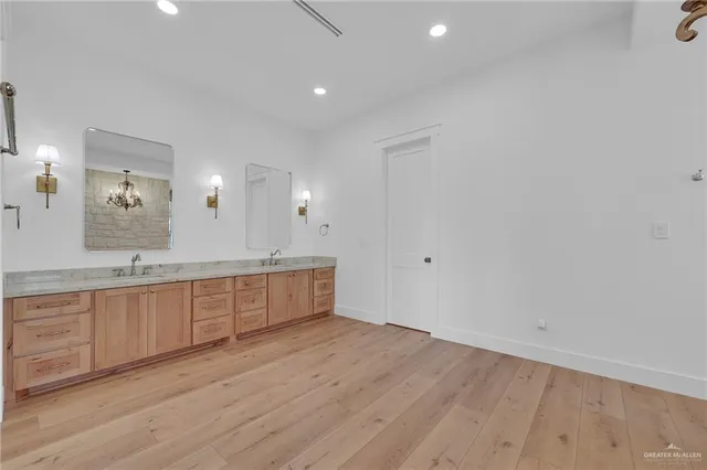 a bedroom with furniture and a large window