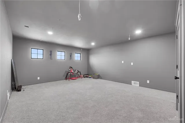 a view with cabinets and wooden floor