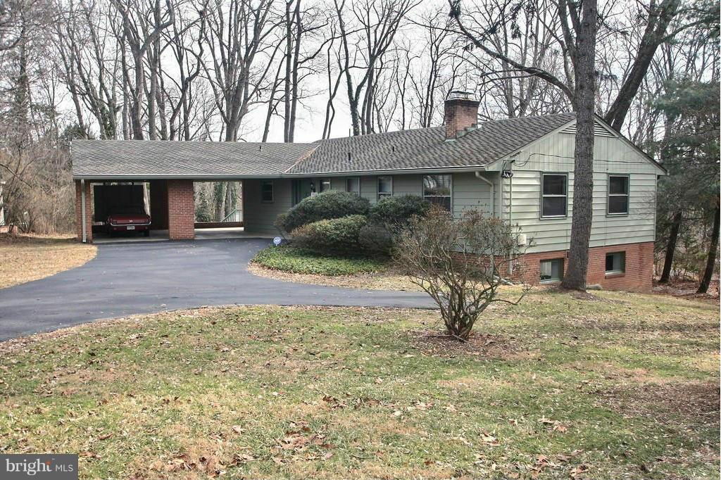 9119 Levelle Drive Chevy Chase, MD 20815 - Photo 2 of 30 a front view of a house with garden