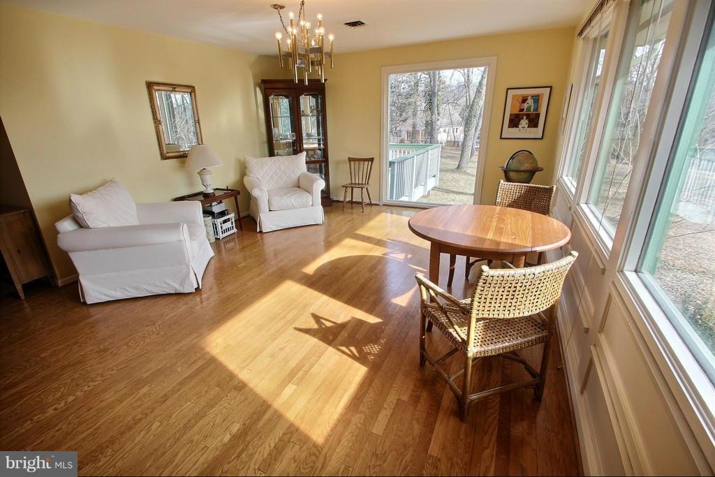 9119 Levelle Drive Chevy Chase, MD 20815 - Photo 12 of 30 a living room with fireplace furniture and a table