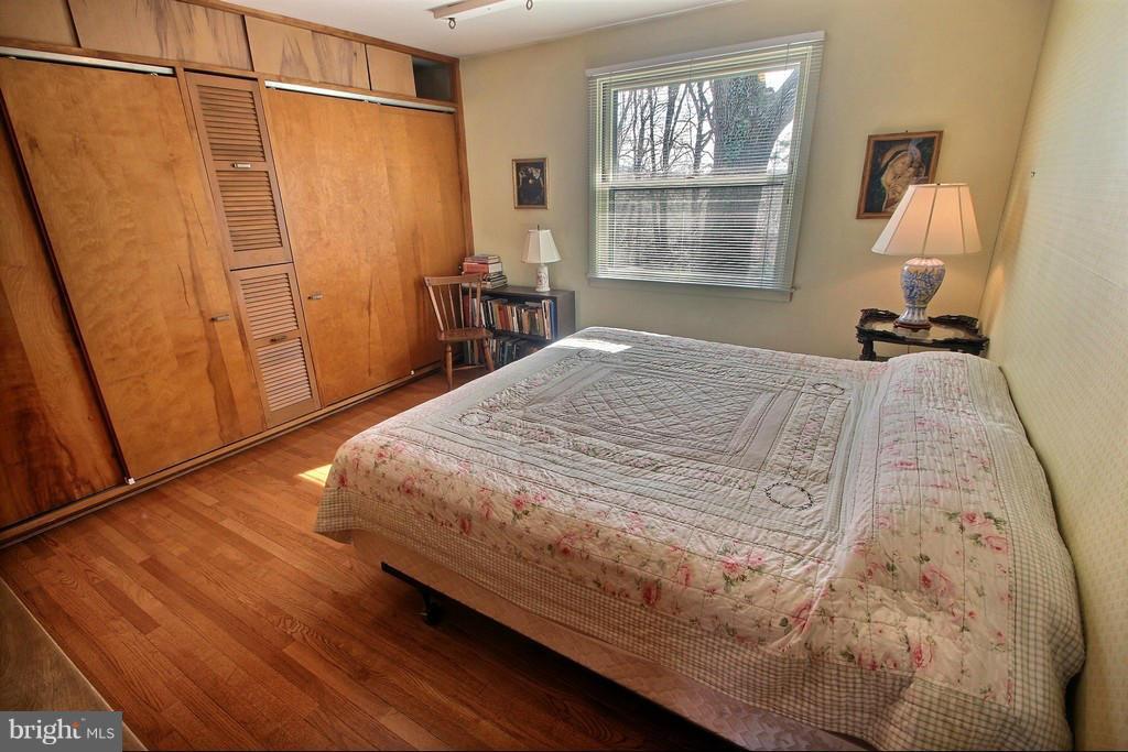 9119 Levelle Drive Chevy Chase, MD 20815 - Photo 17 of 30 a bed sitting in a bedroom next to a window