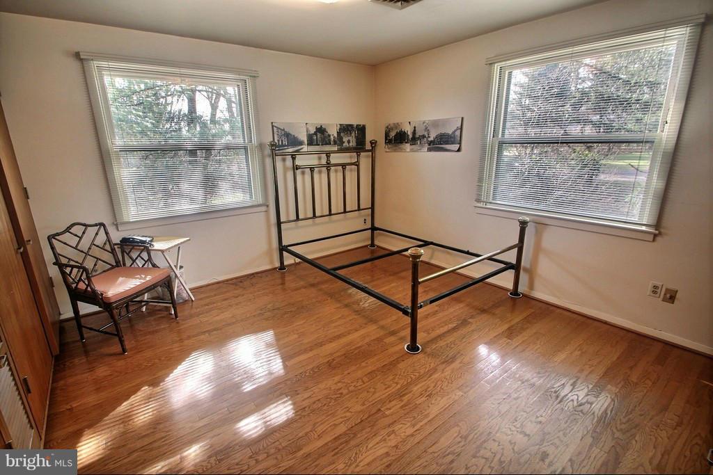 9119 Levelle Drive Chevy Chase, MD 20815 - Photo 19 of 30 a living room with hardwood floor and windows