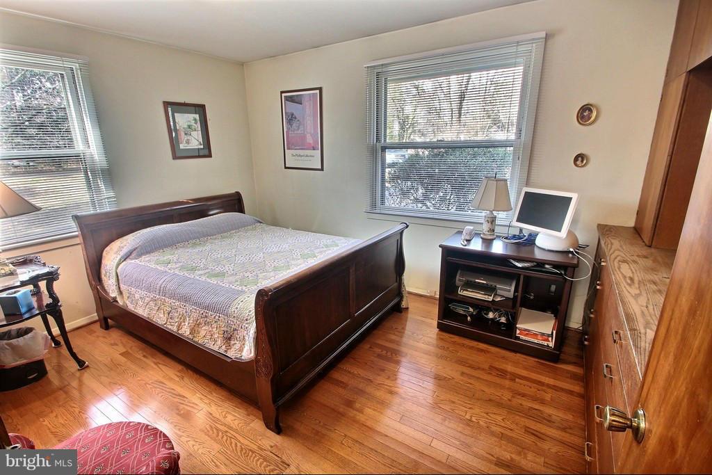 9119 Levelle Drive Chevy Chase, MD 20815 - Photo 20 of 30 a bedroom with a bed and a window
