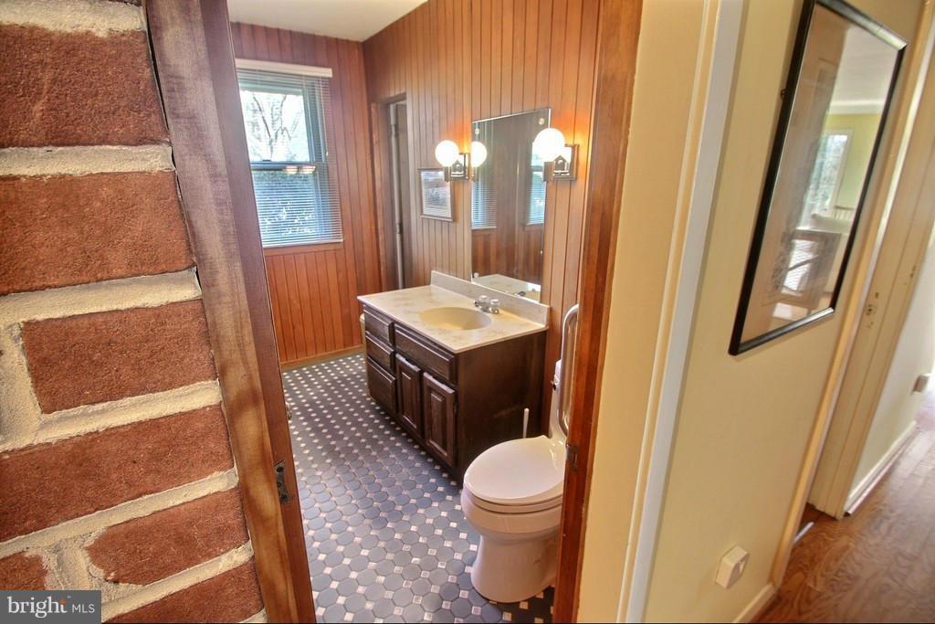 9119 Levelle Drive Chevy Chase, MD 20815 - Photo 21 of 30 a bathroom with a sink a toilet and shower