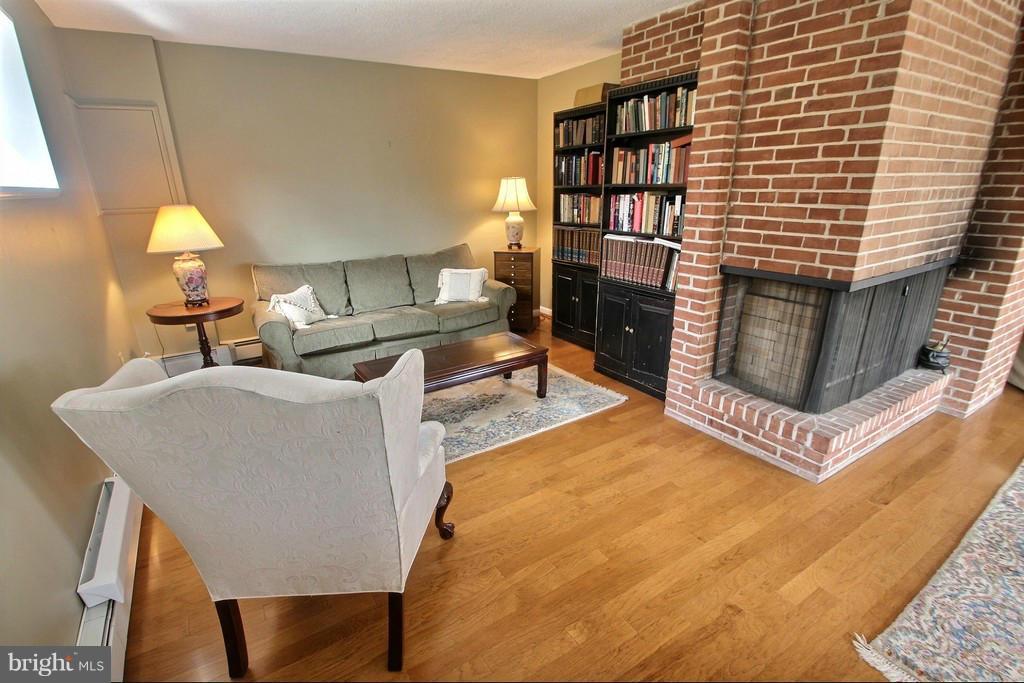 9119 Levelle Drive Chevy Chase, MD 20815 - Photo 25 of 30 a living room with a couch and a table