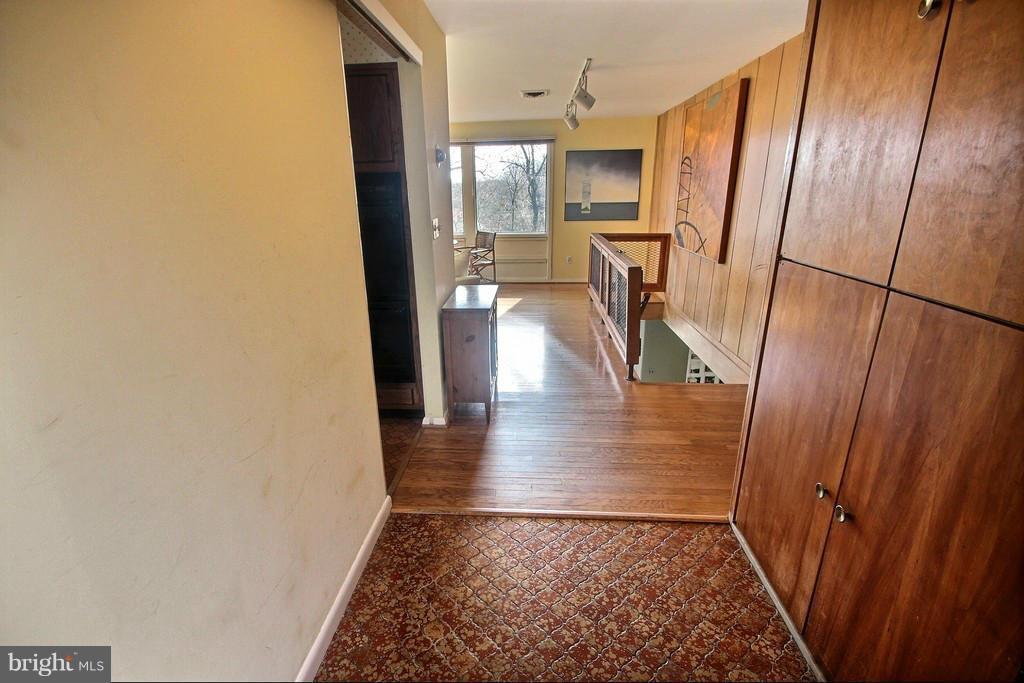 9119 Levelle Drive Chevy Chase, MD 20815 - Photo 7 of 30 a view of a hallway view with wooden floor and living room