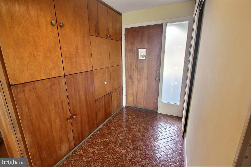 9119 Levelle Drive Chevy Chase, MD 20815 - Photo 8 of 30 an entryway door with wooden floor