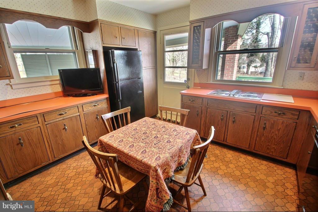 9119 Levelle Drive Chevy Chase, MD 20815 - Photo 9 of 30 a dining room with furniture and window