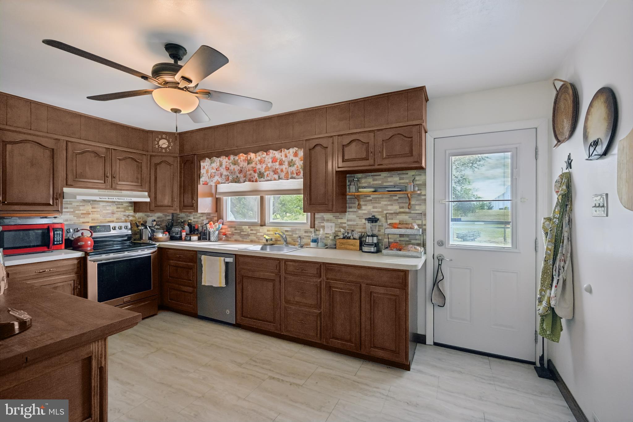 328 Pedricktown Road Swedesboro, NJ 08085 - Photo 13 of 41 a kitchen with cabinets a window and appliances