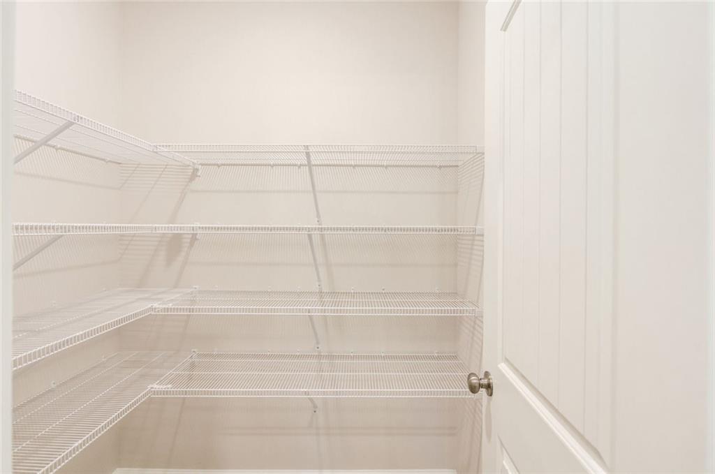 6350 Pine Ridge Point Lula, GA 30554 - Photo 14 of 33 a view of a room with racks on the wall