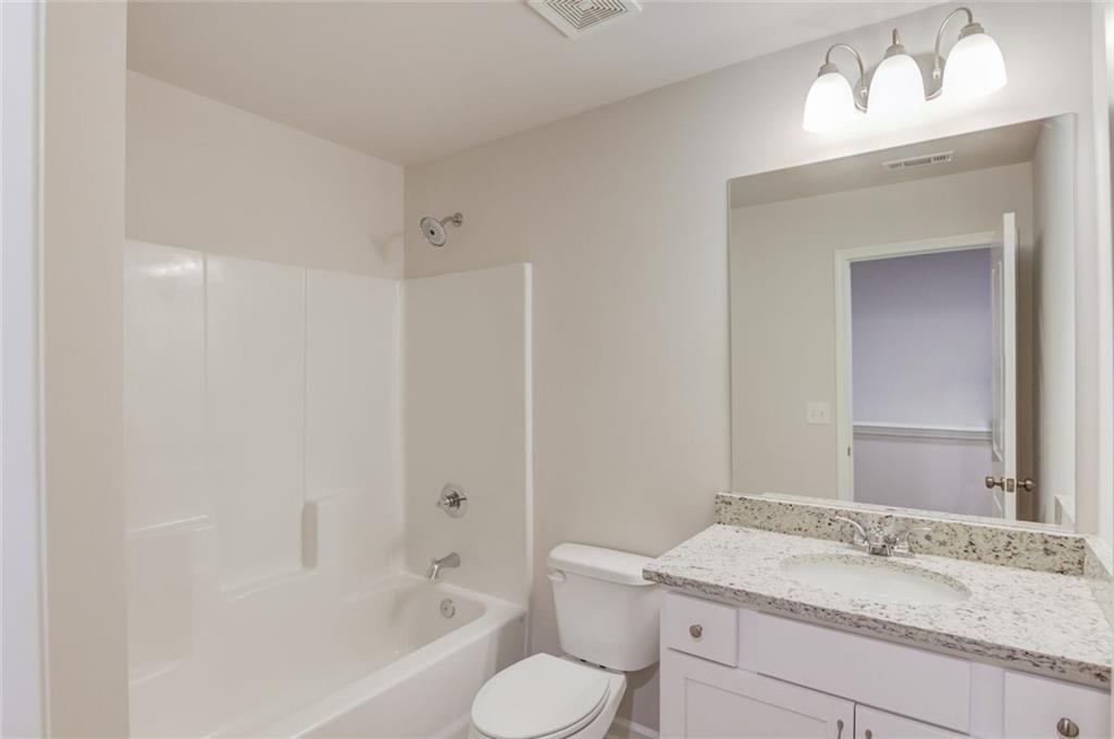 6350 Pine Ridge Point Lula, GA 30554 - Photo 26 of 33 a bathroom with a sink toilet and shower