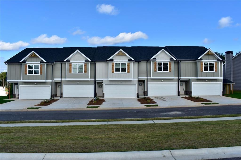 6350 Pine Ridge Point Lula, GA 30554 - Photo 32 of 33 a front view of a house with a yard