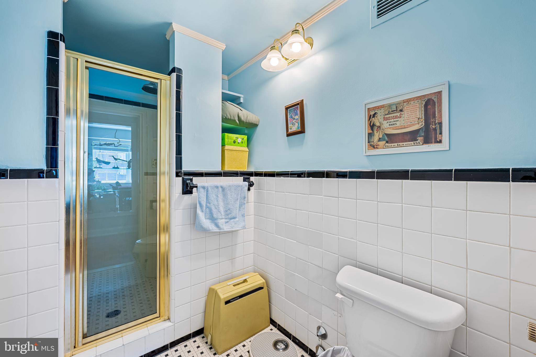 3601 Greenway, Unit 705 Baltimore, MD 21218 - Photo 22 of 30 a white toilet sitting next to a bathroom sink