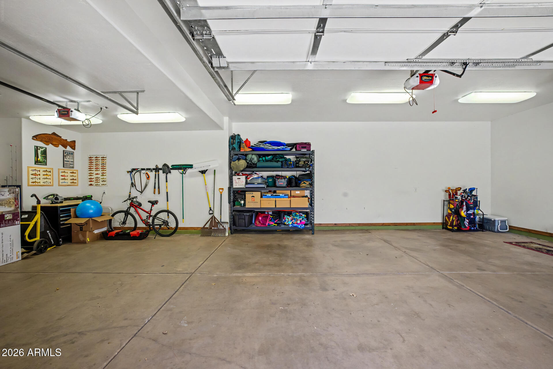 1681 South Jimson Loop Show Low, AZ 85901 - Photo 66 of 105 a view of a garage with a bike and car