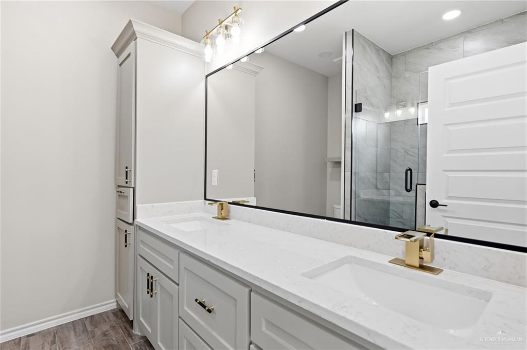18032 Spruce Street Combes, TX 78552 - Photo 11 of 14 a bathroom with a sink and a mirror