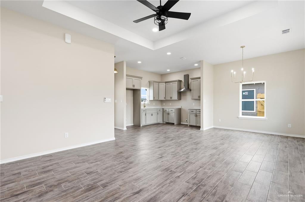 18032 Spruce Street Combes, TX 78552 - Photo 2 of 14 a view of a kitchen with a sink dishwasher refrigerator stove and a cabinets