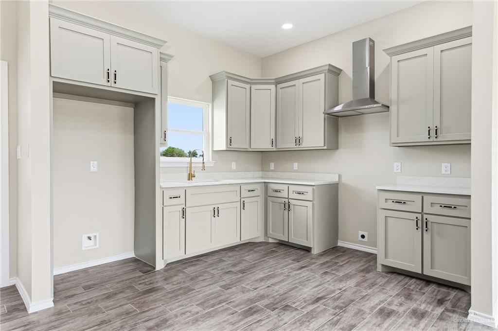 18032 Spruce Street Combes, TX 78552 - Photo 4 of 14 a kitchen with cabinets oven and a dishwasher