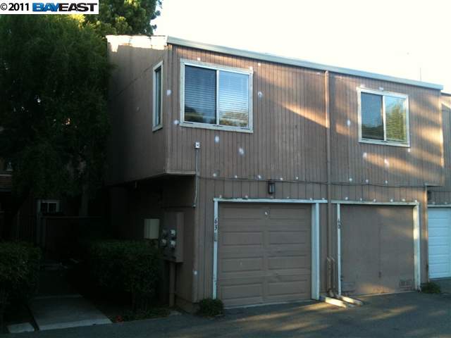 3901 Clayton Road, Unit 60 Concord, CA 94521 - Photo 1 of 1 a side view of a house with a yard
