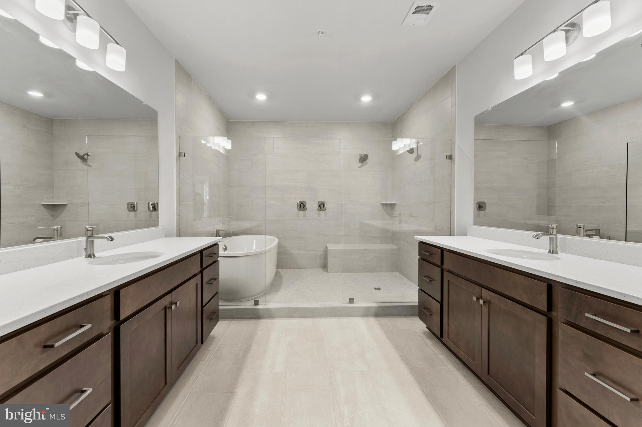 608 Catamaran Way National Harbor, MD 20745 - Photo 18 of 30 a spacious bathroom with a double vanity sink mirror and toilet