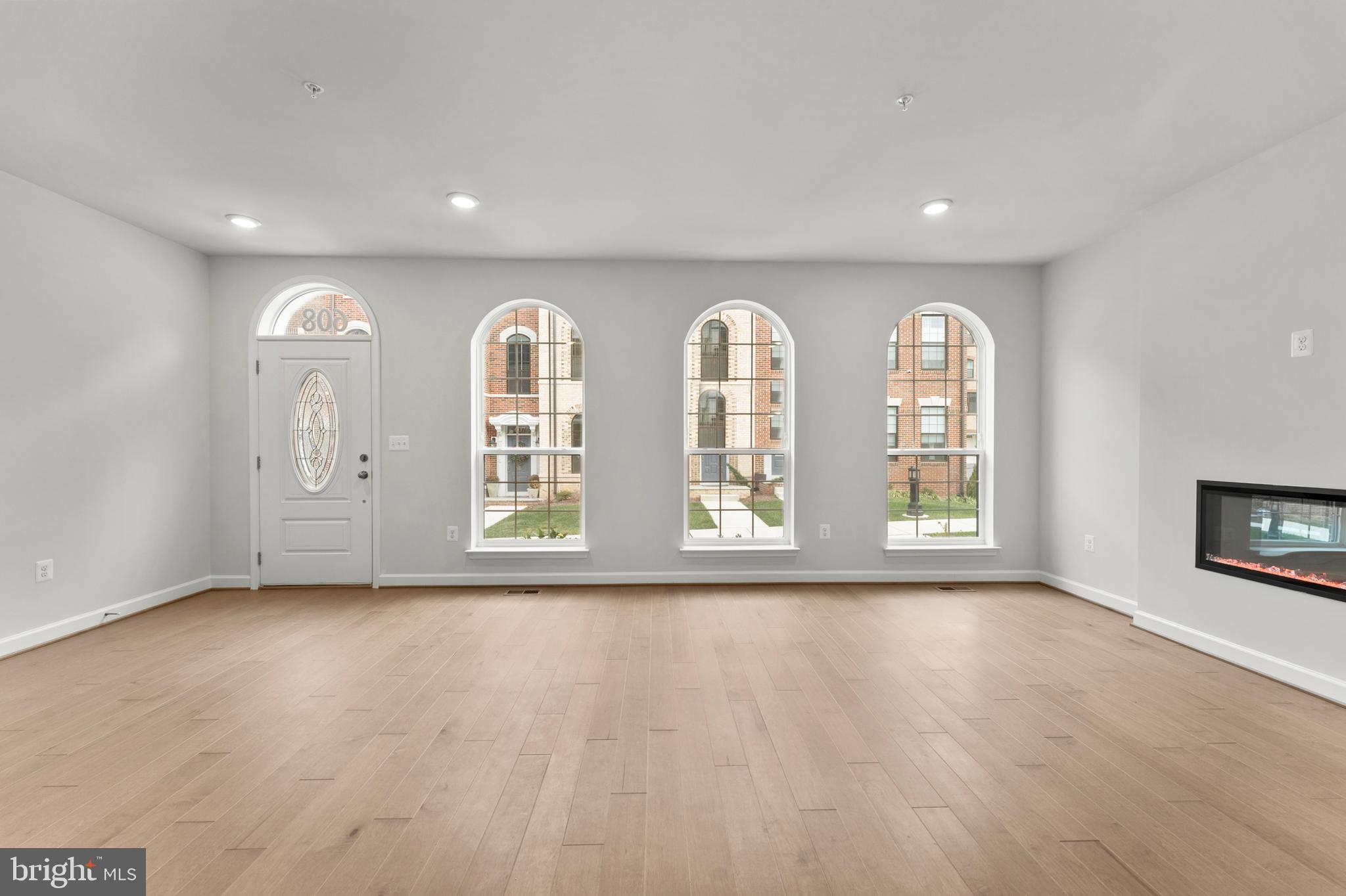 608 Catamaran Way National Harbor, MD 20745 - Photo 2 of 30 a view of an empty room with a window and wooden floor