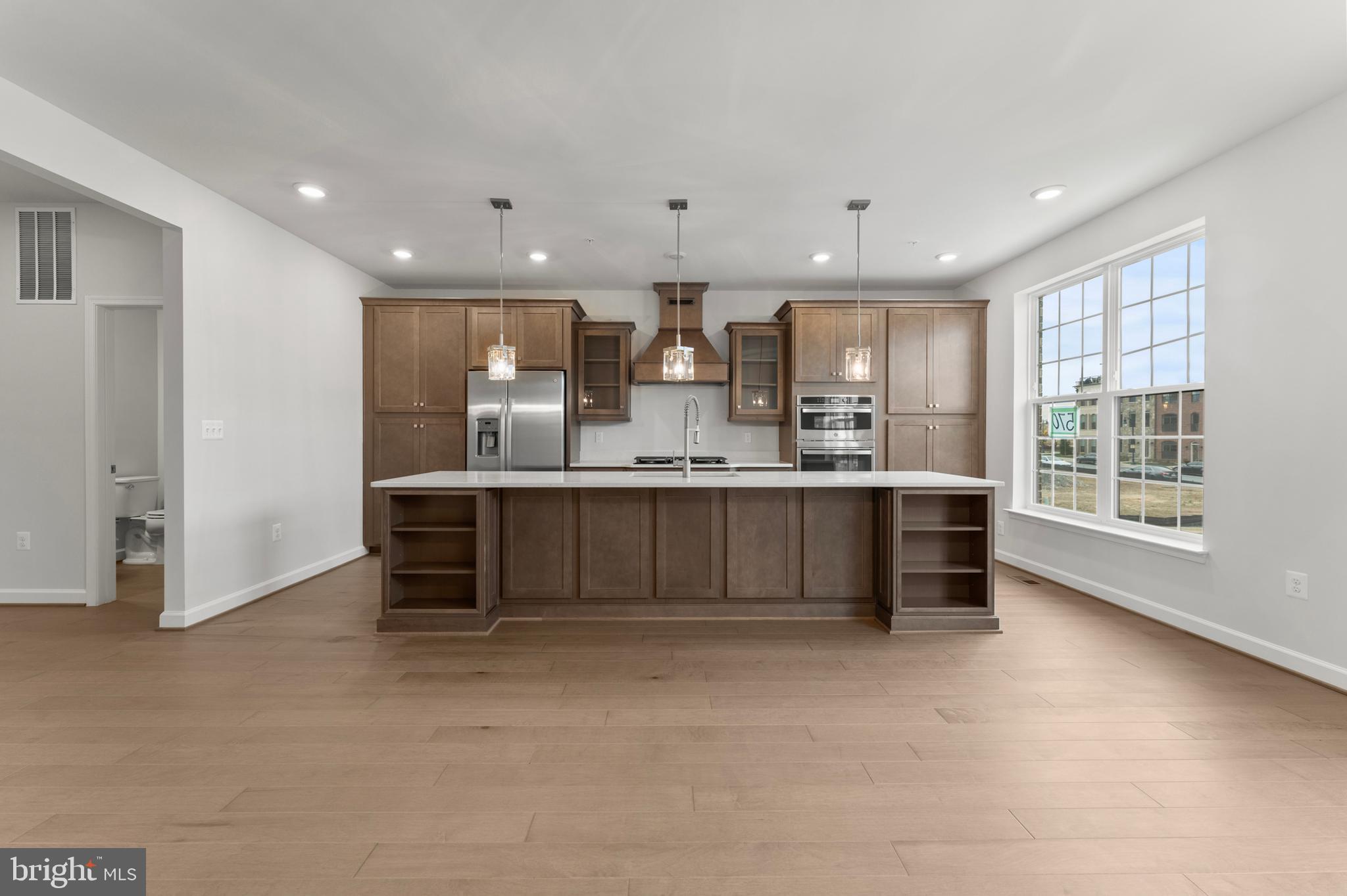 608 Catamaran Way National Harbor, MD 20745 - Photo 7 of 30 a large kitchen with a large window and a counter space