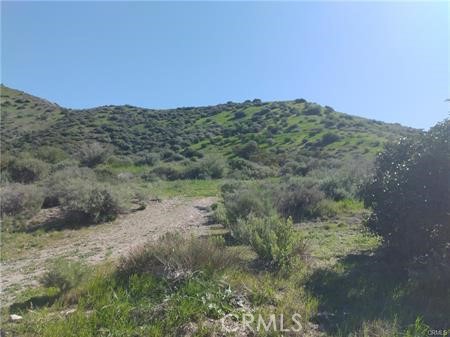62 Las Llajas Canyon Road Simi Valley, CA 93063 - Photo 1 of 5 a view of a large mountain with mountains in the background