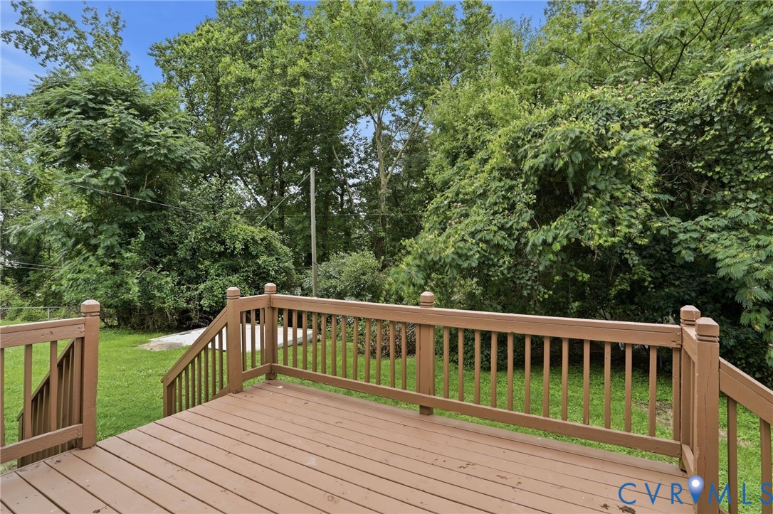 5301 Dalglish Road Richmond, VA 23223 - Photo 38 of 42 Wood-finish deck with full railings and steps, ove