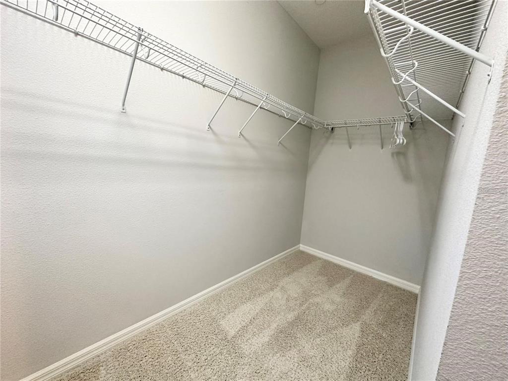 122 Zamora Place Oviedo, FL 32765 - Photo 15 of 23 a view of a room with racks on the wall