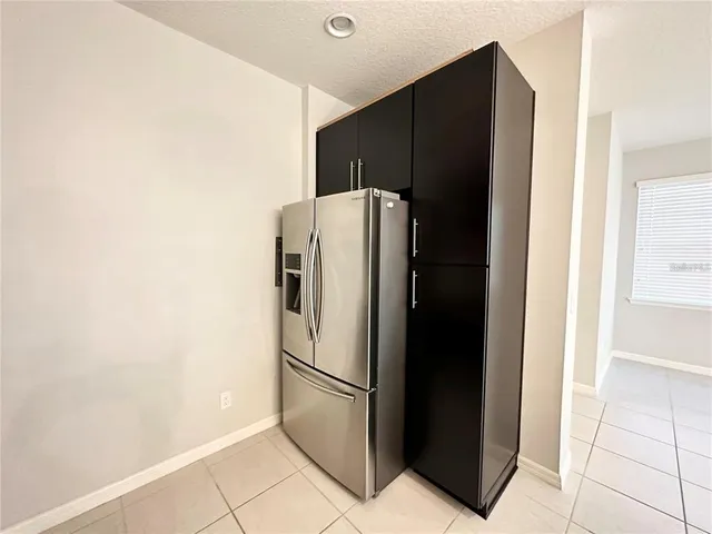 a white refrigerator freezer sitting in a kitchen
