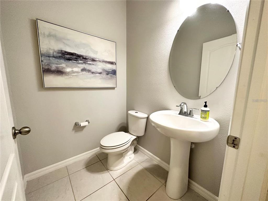 122 Zamora Place Oviedo, FL 32765 - Photo 10 of 23 a bathroom with a toilet sink and mirror