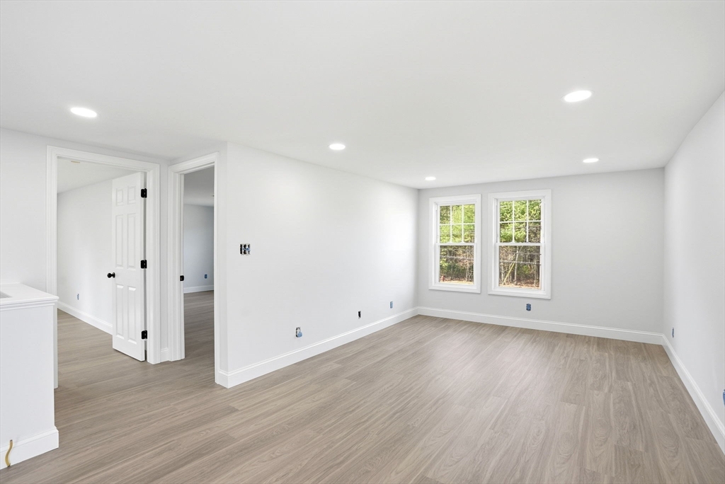 357 Wareham Street Middleboro, MA 02346 - Photo 27 of 42 wooden floor in an empty room with a window