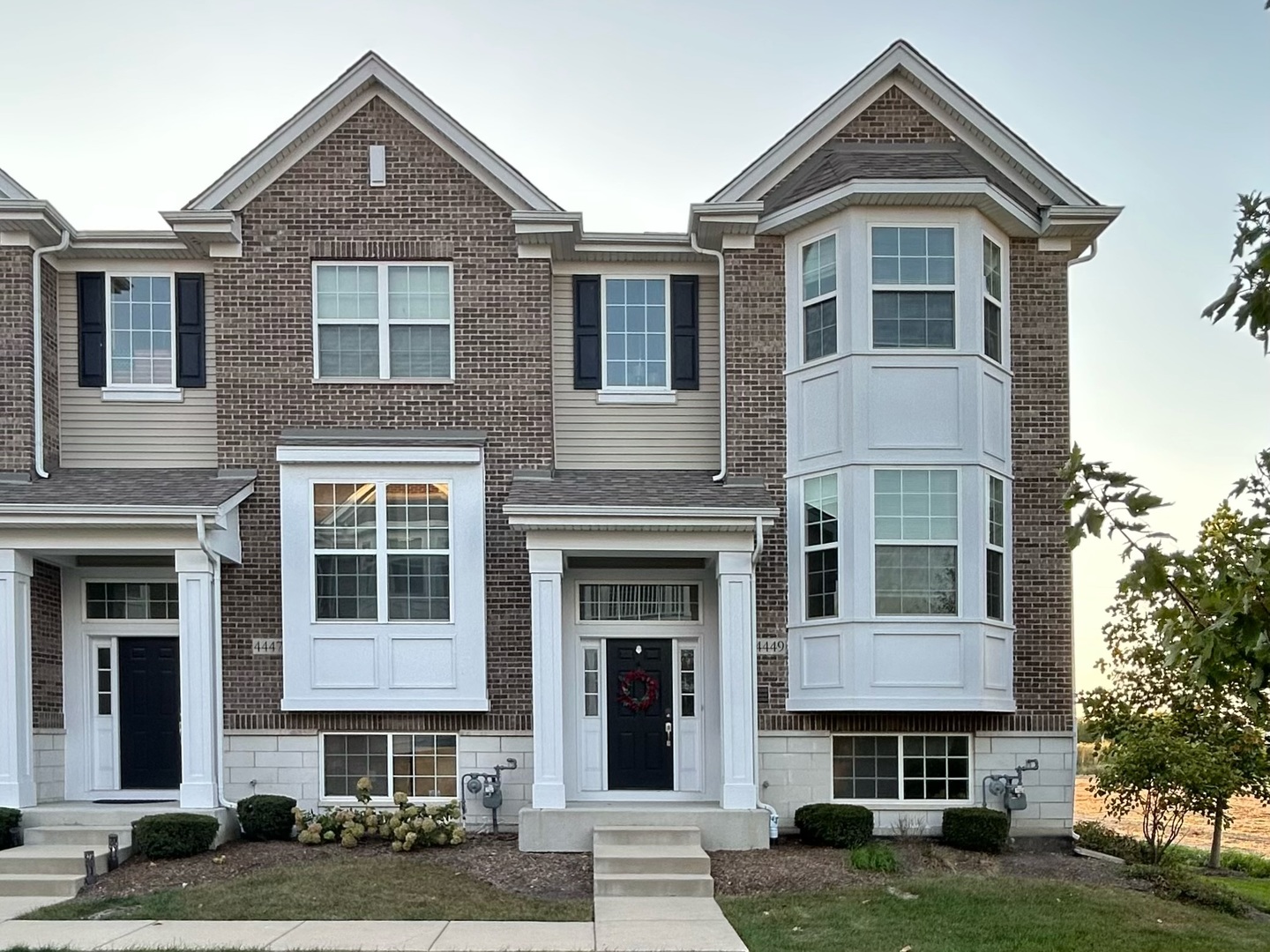 4449 Monroe Court Naperville, IL 60564 - Photo 1 of 2 a front view of a house with garden