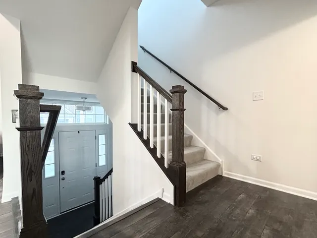 a view of entryway with wooden floor