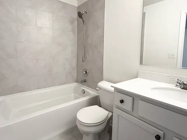 a bathroom with a sink a toilet and a bathtub